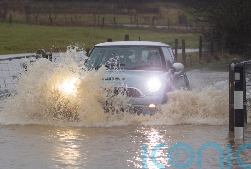 Councils deluged with compensation claims for flash floods as road funding cut