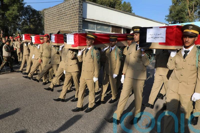 Funerals held in Syria for dozens of victims of attack on military ceremony