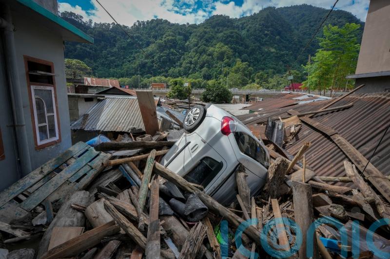 Indian rescue helicopters fly to Himalayan area where floods killed at least 52