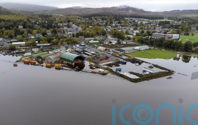 Flood warnings remain in place as rain eases