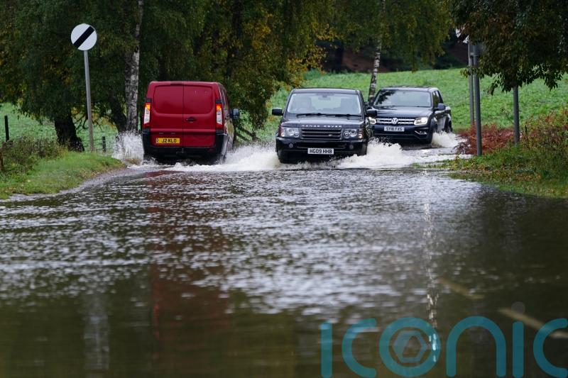 Police use drones to search for missing man swept into river after extreme rain
