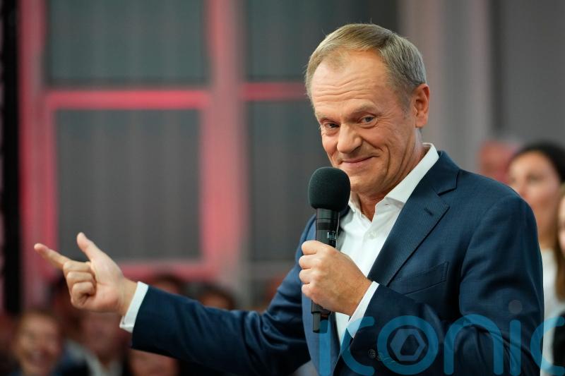 Poles vote in huge numbers for centrist opposition