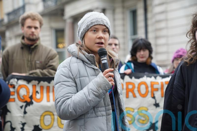 Greta Thunberg at protest demanding oil chiefs pull their money out of politics