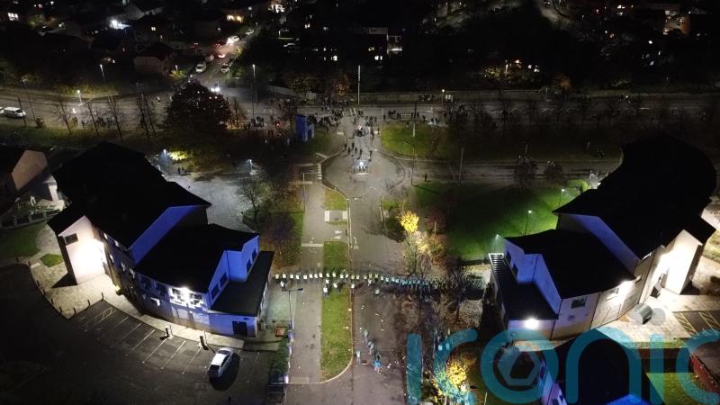Drone footage shows ‘thugs’ aiming fireworks at riot police