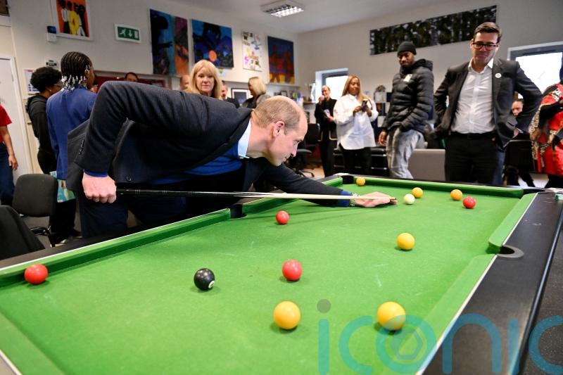 William learns about project tackling youth violence on Moss Side visit
