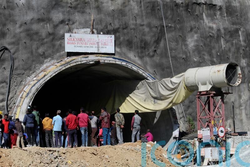 Indian rescuers begin drilling to reach 40 people trapped in collapsed tunnel