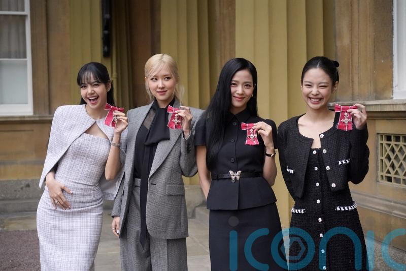 King presents K-pop band Blackpink with honorary MBEs at Buckingham Palace