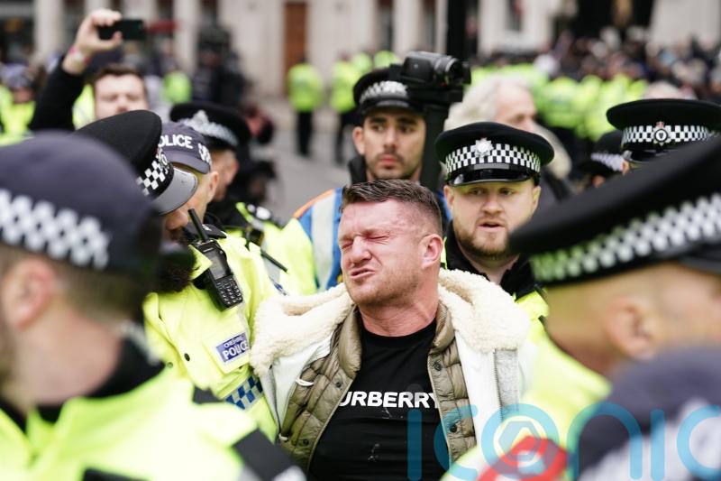 Tommy Robinson sprayed by police during arrest at march against antisemitism