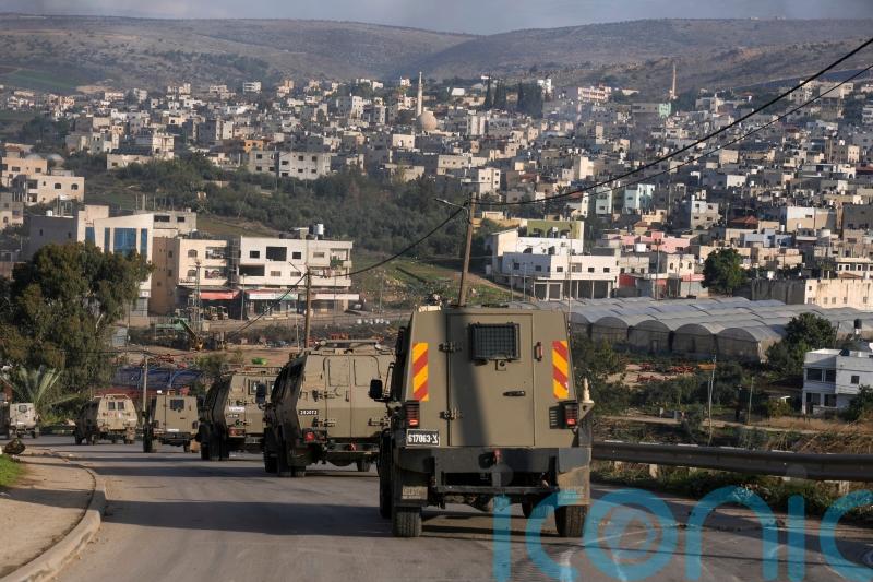 Six Palestinians killed in Israeli military raid on refugee camp, officials say