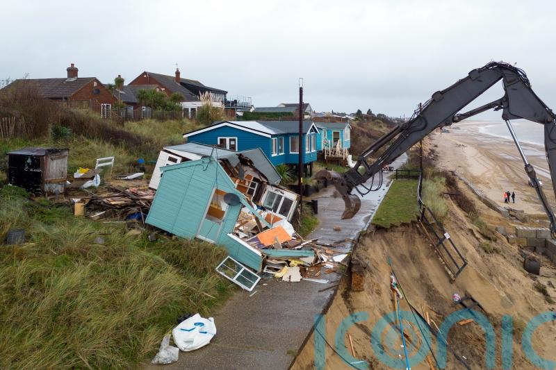 Demolition of five homes on erosion-hit coastline begins