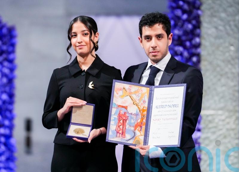 Twins accept Nobel Peace Prize on behalf of mother jailed in Iran