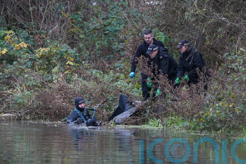 Police divers remove large black bag from river during hunt for Gaynor Lord