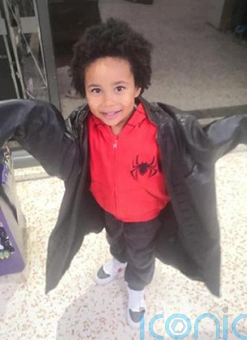 Mother accused of killing her four-year-old son sobs in court