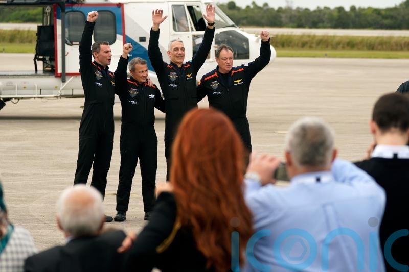 Astronauts head to space station on chartered flight