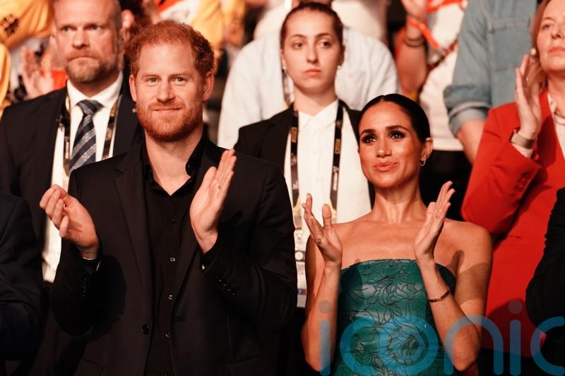 Harry and Meghan pose with republic-backing PM at film premiere in Jamaica