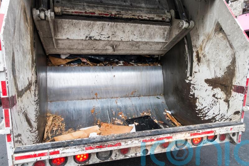 Woman throwing out rubbish survives being compacted in bin lorry