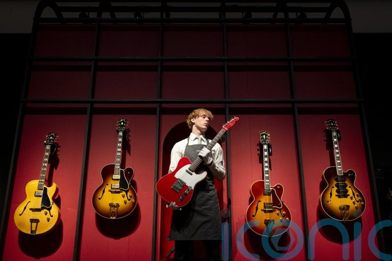 Guitar collection from Dire Straits frontman makes millions for charity