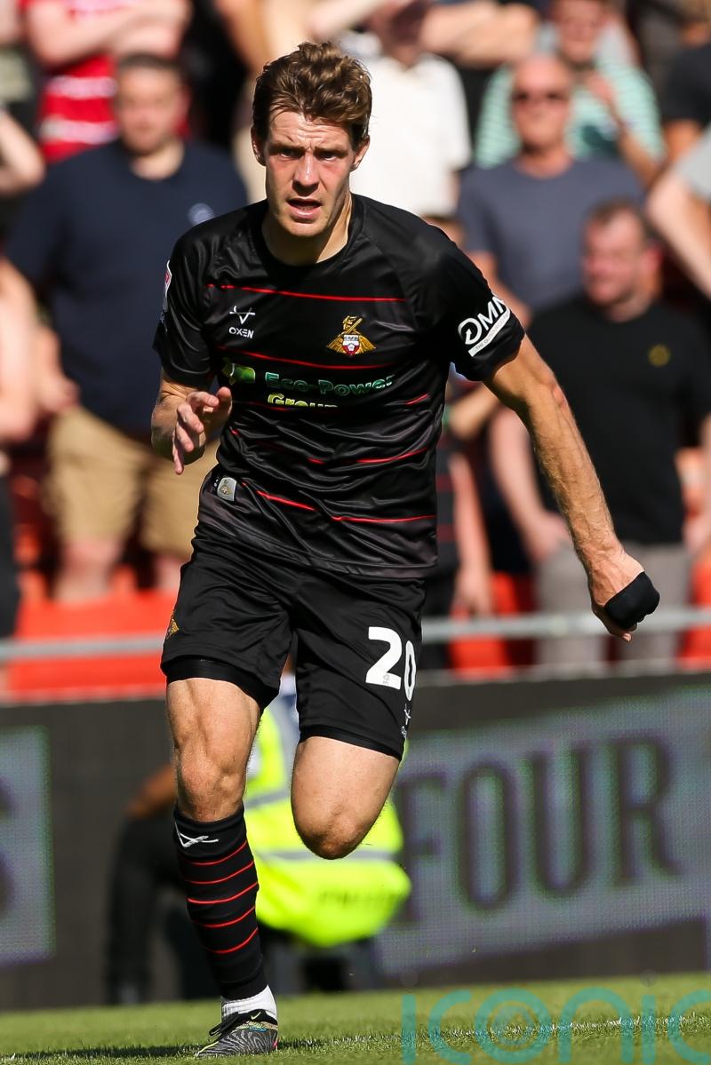 Doncaster leave it late as Joe Ironside penalty earns point at Sutton