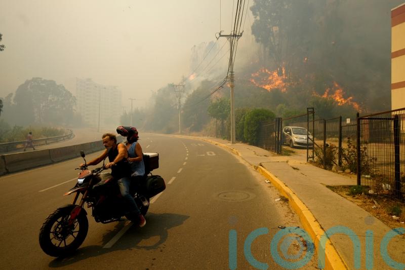 At least 112 dead as forest fires rage in central Chile