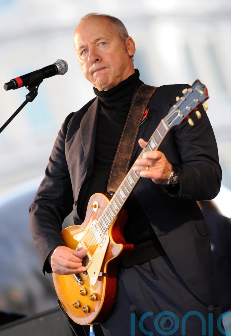 Dire Straits star Knopfler unites world guitar heroes for charity record