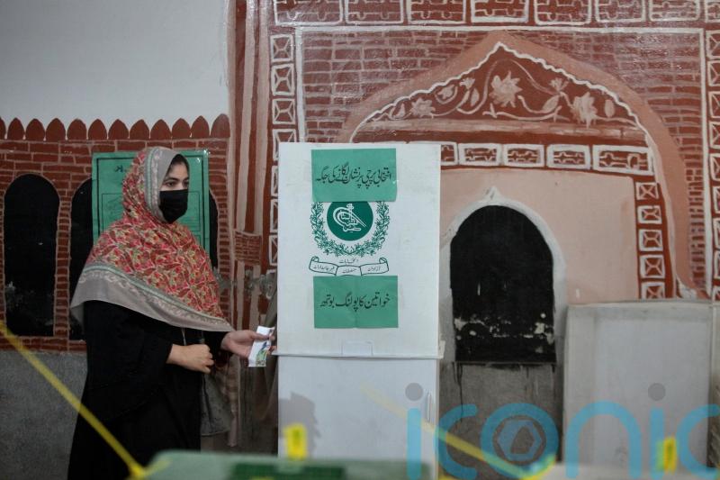 Nawaz Sharif strikes confident note in Pakistan vote marred by Khan imprisonment