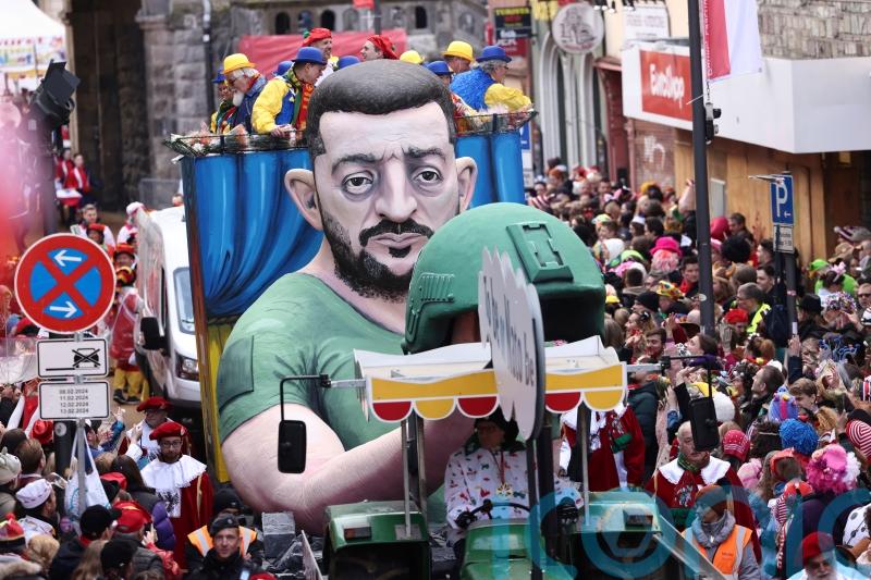 Huge satirical models of Trump, Putin and Zelensky at German carnival parades