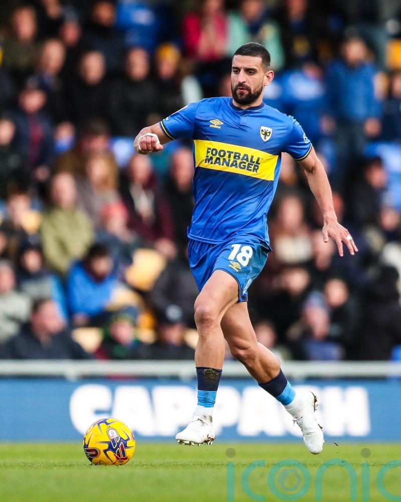 Rival play-off hopefuls AFC Wimbledon and Morecambe share points at Plough Lane
