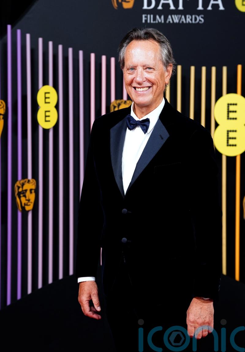 Richard E Grant runs through the Ritz hallway and asks if he will ‘ever grow up’
