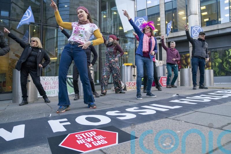 Climate activists stage ‘Stayin’ Alive’ dance demo outside pensions conference