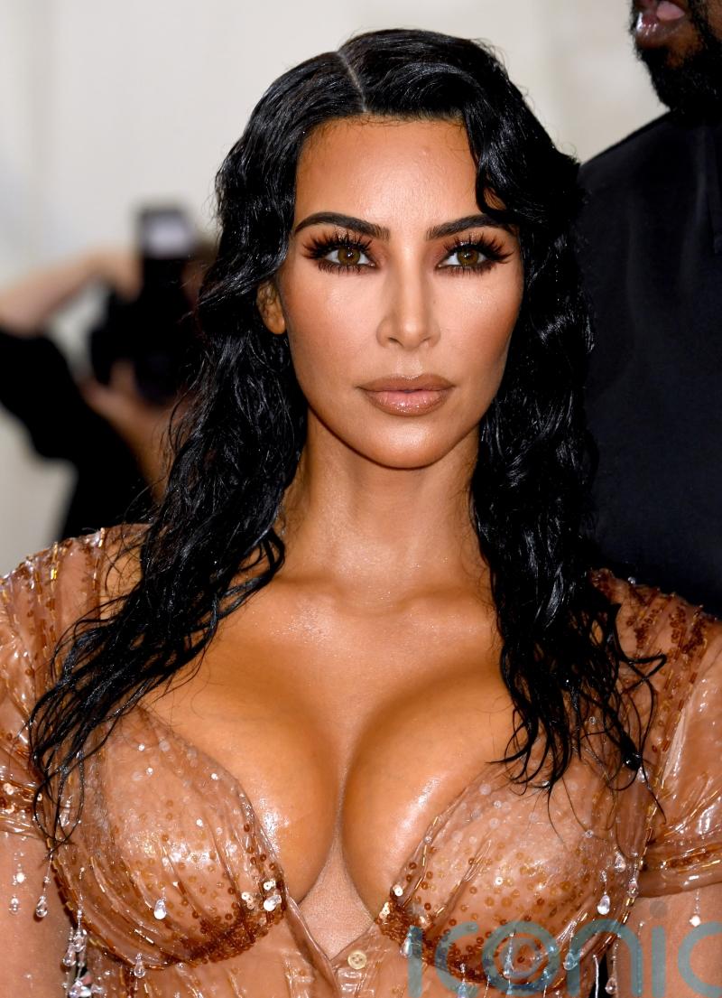 Kim Kardashian wears black dress with Balenciaga price tag left on