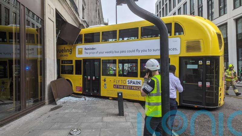 Double-decker bus crashes into building in central London