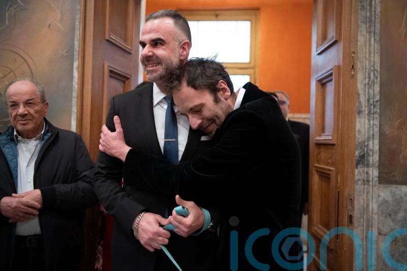 Greek novelist and lawyer are first same-sex couple to wed at Athens city hall