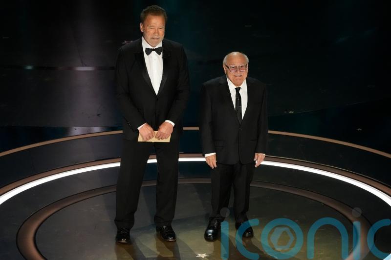 Twins stars and Batman villains Schwarzenegger and DeVito reunite at Oscars