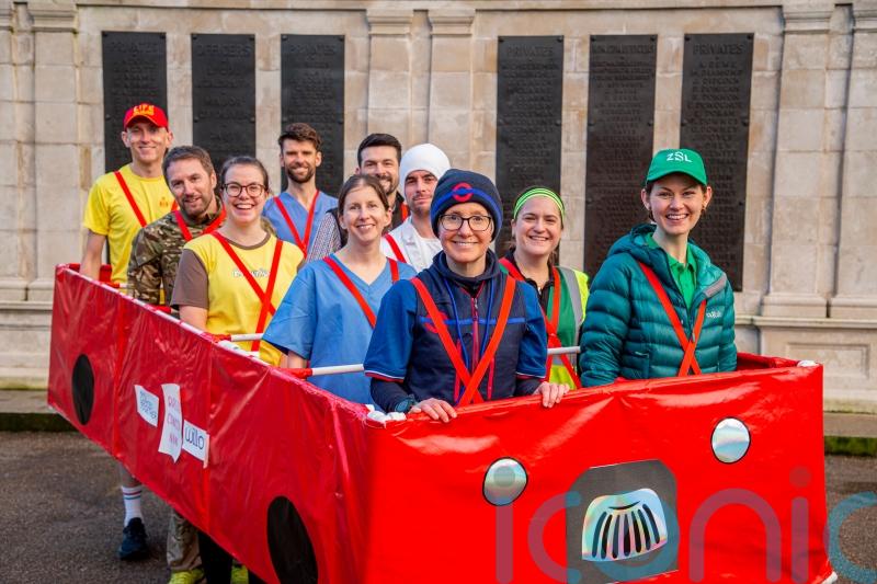 Breast cancer survivor to run London Marathon in 10-person red bus costume