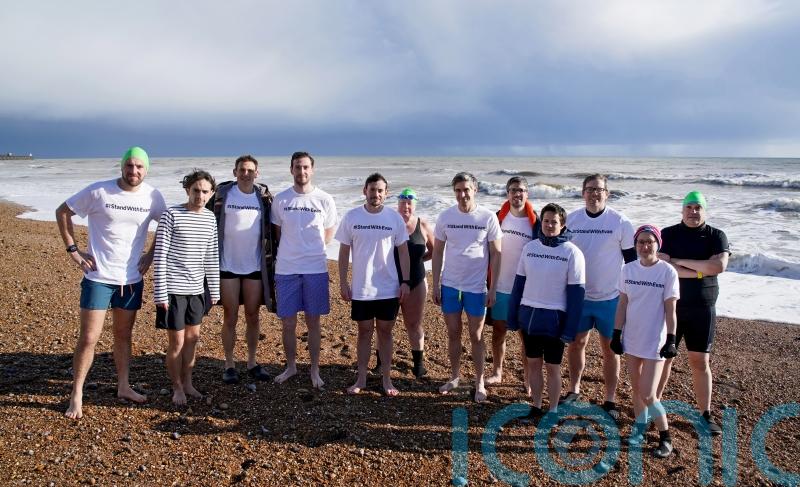 Journalists swim in solidarity one year since US reporter imprisoned in Russia