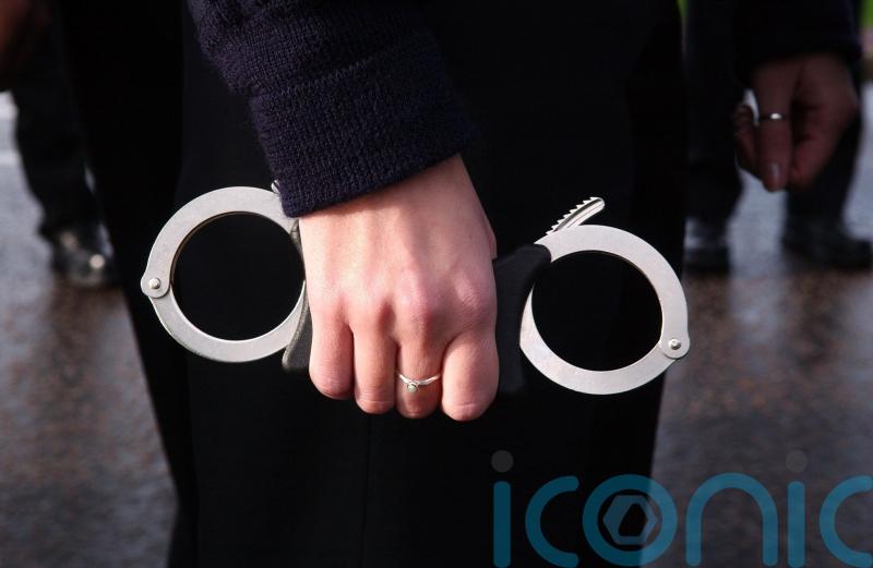 Man arrested after 72-year-old man found dead in block of flats