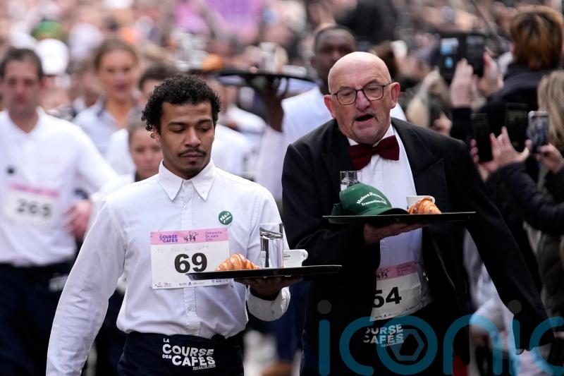 The waiting game! Cafe workers carry loaded trays in 2km race through Paris