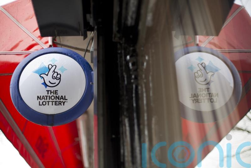 National Lottery firm sees UK sales and earnings slip