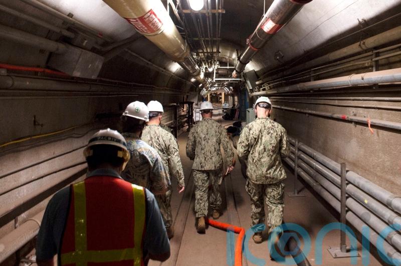 US military drains giant wartime fuel tanks which had poisoned water supply