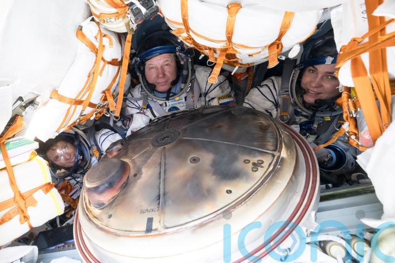 Soyuz capsule carrying three crew from space station lands safely in Kazakhstan