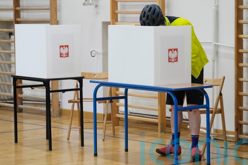 Exit poll shows opposition ahead of PM Tusk’s party in Poland’s local elections
