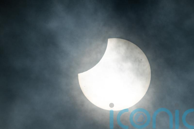 Clouds plague UK spectators as millions in US witness total solar eclipse
