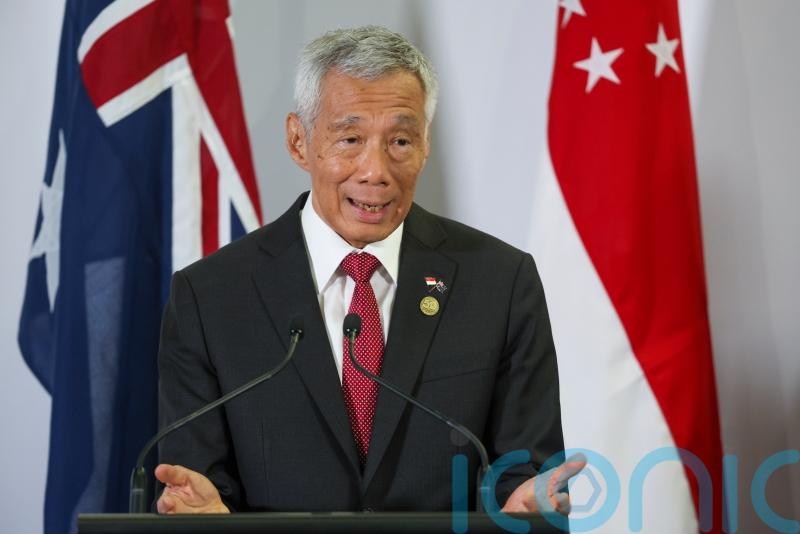 Singapore’s prime minister will step down on May 15