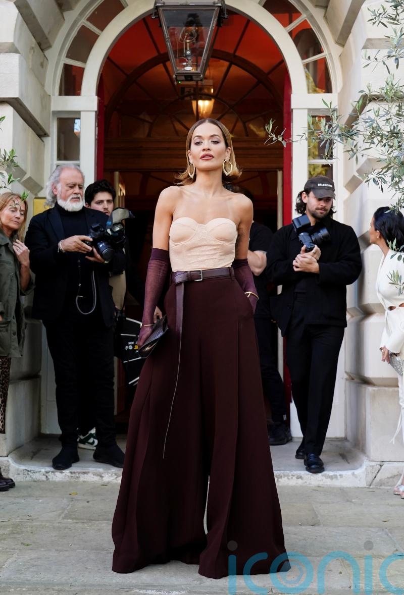 Rita Ora leans into opera glove trend at London launch for new haircare brand