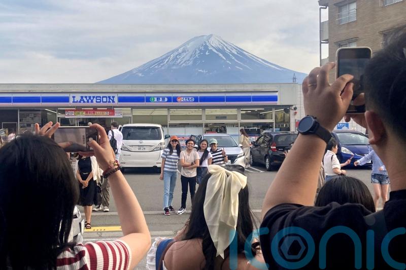 Town building big screen to block view of Mount Fuji in bid to deter tourists