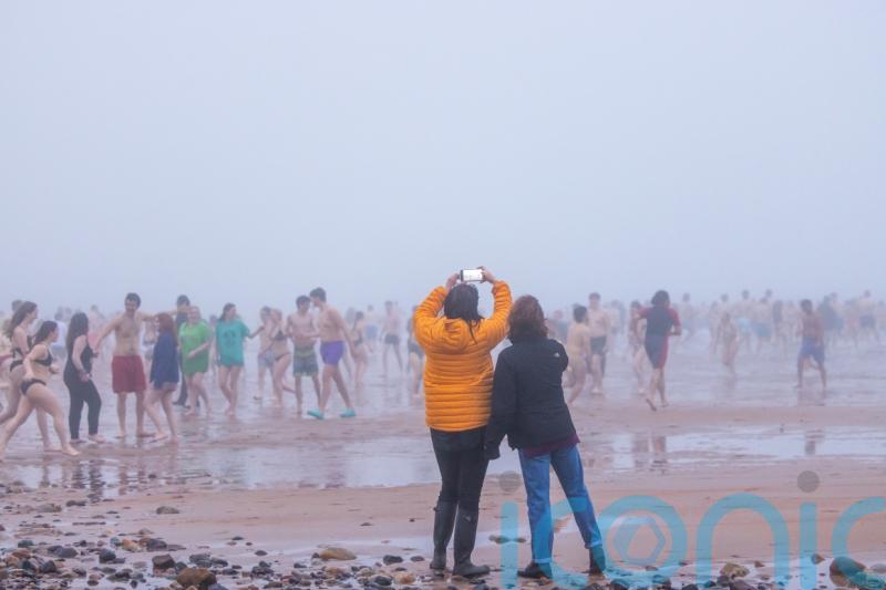 St Andrews students take the plunge with traditional May Dip