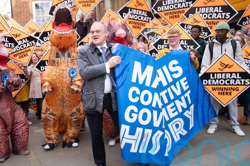 Sir Ed Davey poses with &lsquo;Tory dinosaurs&rsquo; in latest election campaign stunt