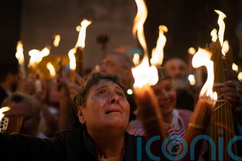 Orthodox worshippers greet ancient ceremony of the Holy Fire in Jerusalem