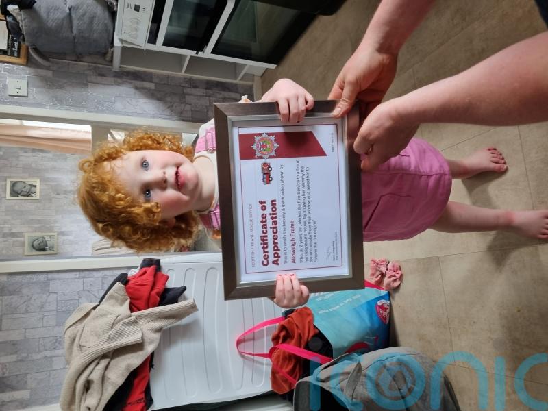 Two-year-old honoured for quick-thinking after neighbours saved from fire