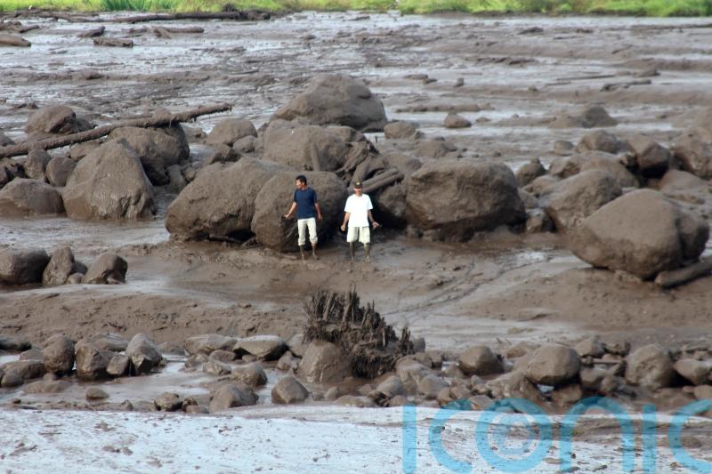 Flash floods caused by heavy rain and cold lava flow kill 37 in Indonesia